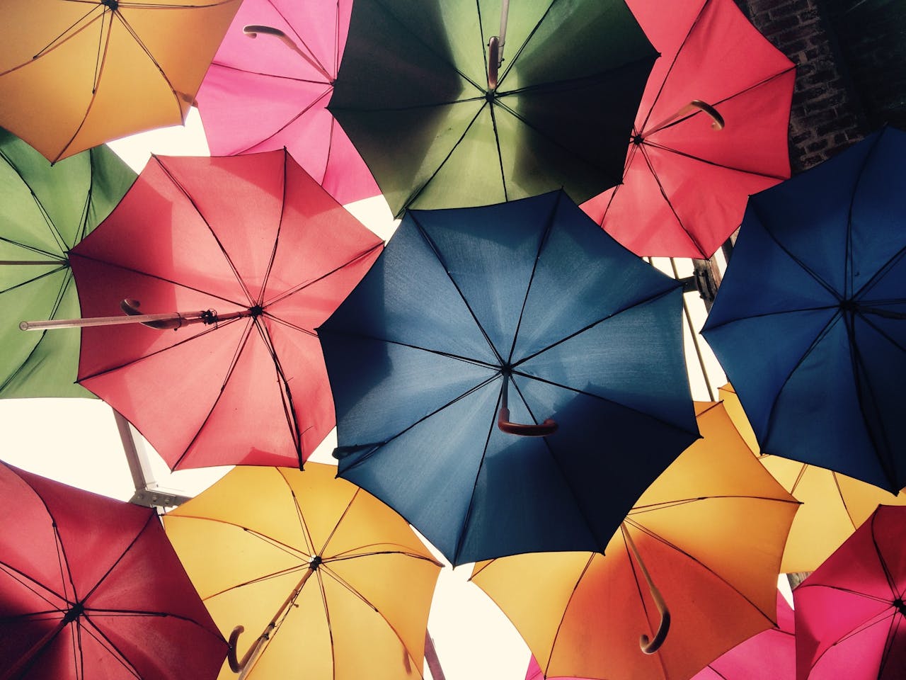 home-hero Vibrant umbrellas create a colorful canopy in Greater London, offering protection from sun and rain.